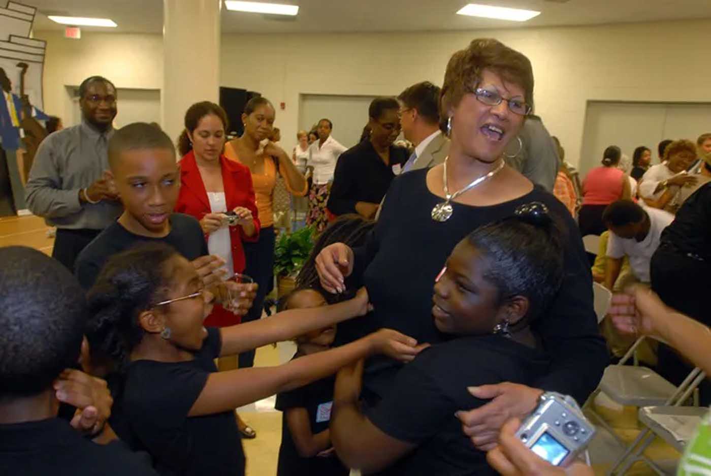Dorothy Counts-Scoggins with Charlotte students.