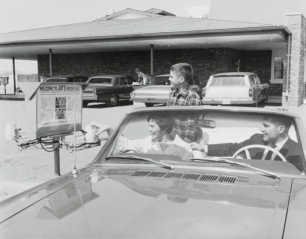 Family Orders Food at Drivein Restaurant.