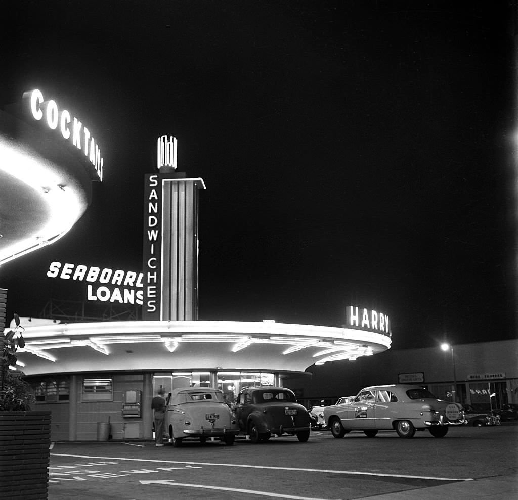 Cars park outside Harry Carpenter's Drive-in Restaurant on the southeast corner of Sunset and Vine in Los Angeles, 1949