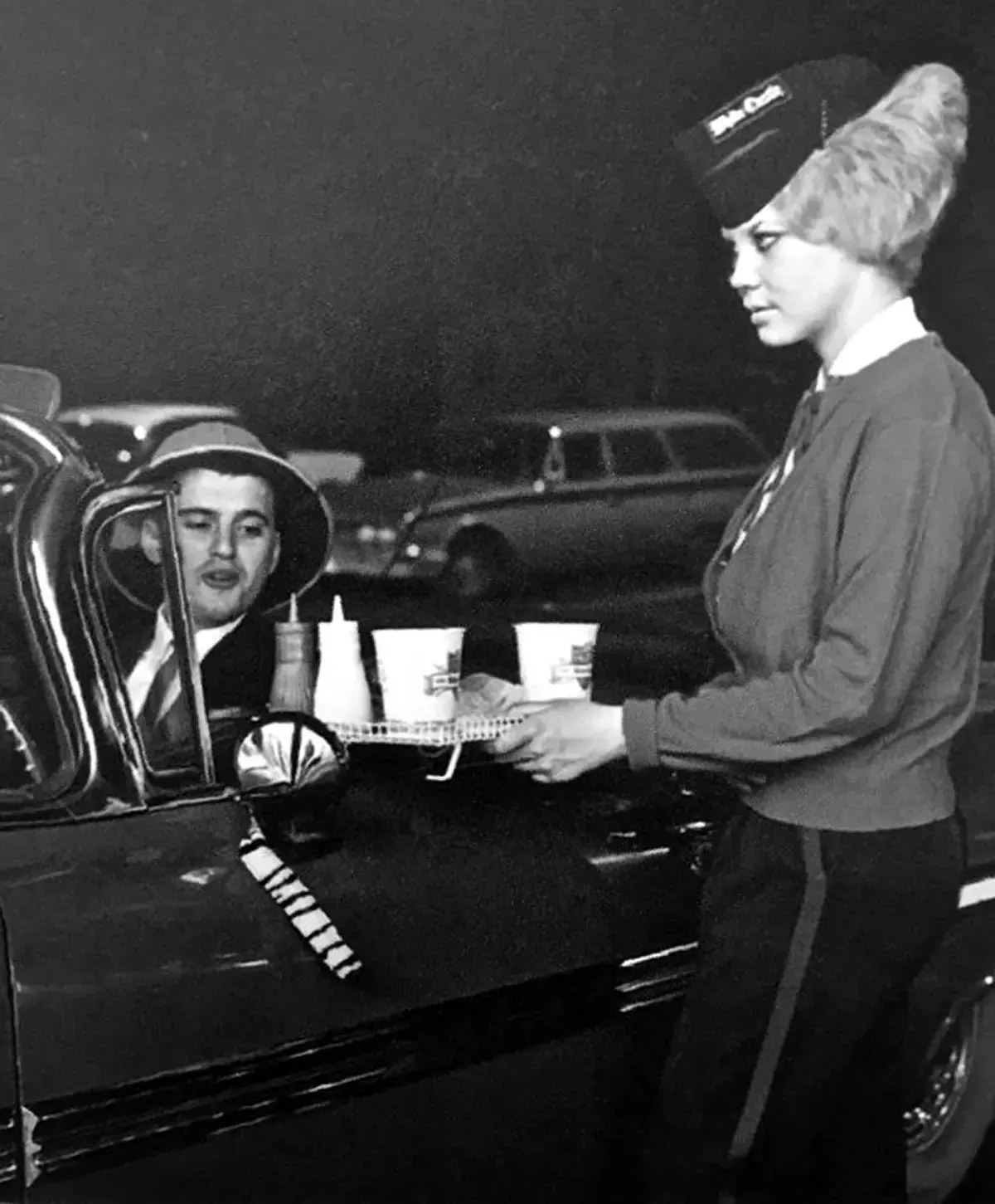 The carhop on the wall at a White Castle in Wentzville, Missouri, 1960s.