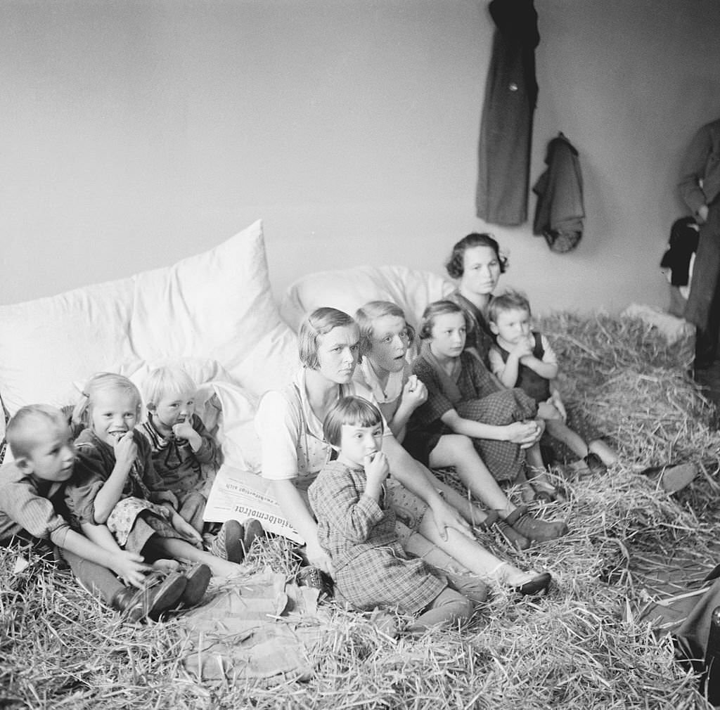 Czech Refugee Children sitting on Straw.