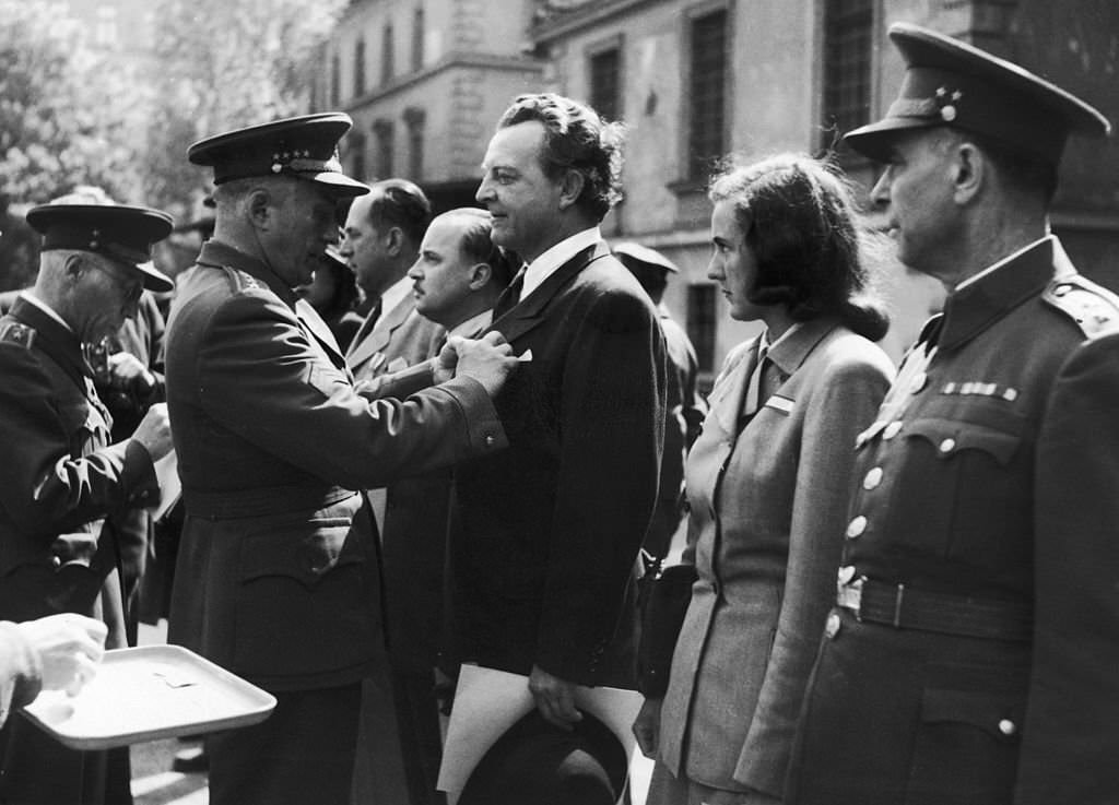 Czech General Ludvik Svoboda decorates members of the Revolutionary Factory Committees, who took over the running of facilities after the Germans were defeated, 1945.