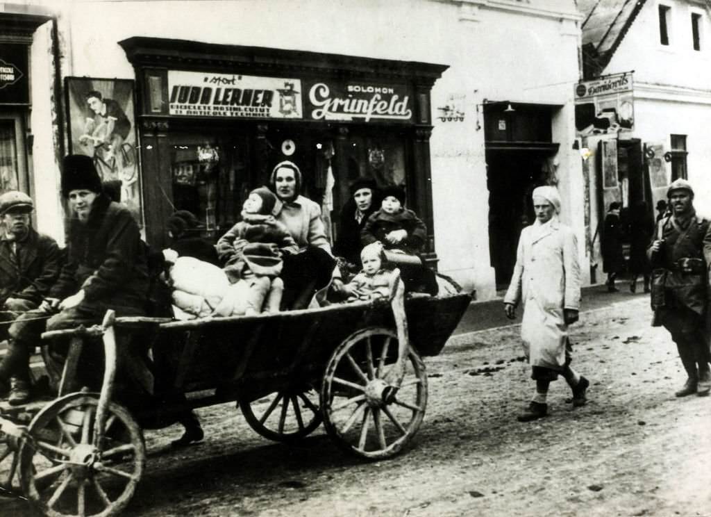 Czech refugees, women and children in a typical cart, arrive in the Romanian border town of Sighet Marmatiei.
