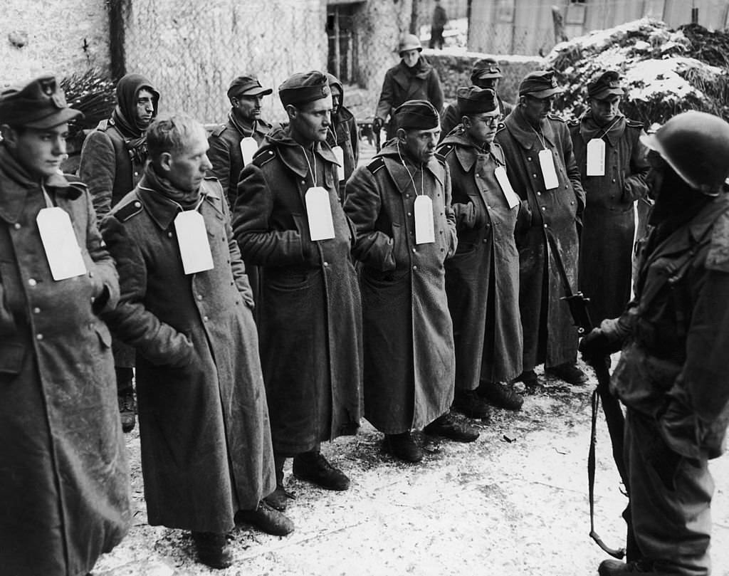 Captured German troops, including members of the SS and Luftwaffe, and volunteers from Poland and Czechoslovakia, during World War II, 1st June 1945.