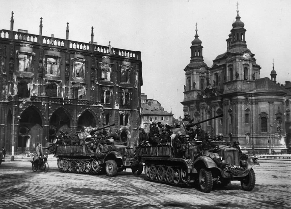 View of German troops exiting Prague in trucks after their surrender, Czechoslovakia, World War II.