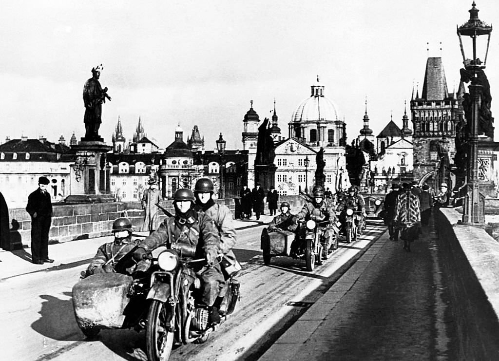 The German Army enters Prague with a procession of motorcycles in March 1939, several months prior to the commencement of the European War.