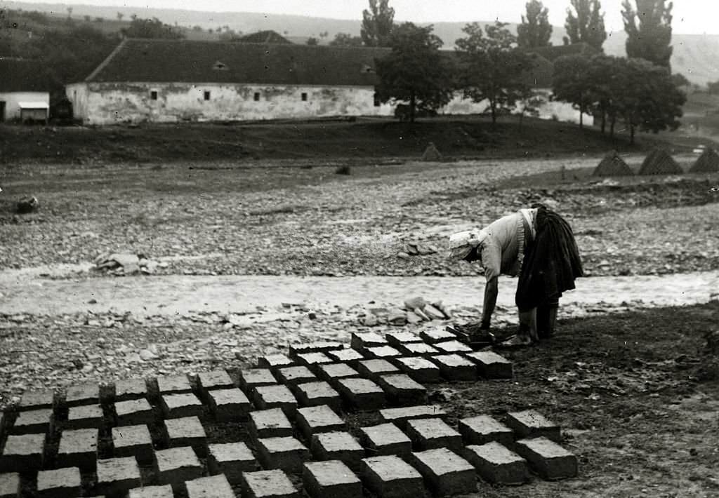 A Czech woman pressed into service making bricks after the German occupation of her country, Adolf's Hitler's Germany invaded Czechoslovakia in March 1939