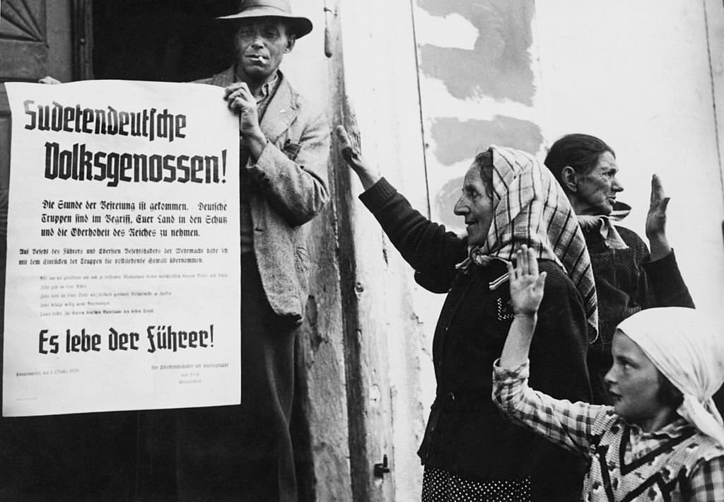 Ethnic Germans salute a message of liberation from German commander Wilhelm Ritter von Leeb after the German annexation of the Sudetenland, 2nd October 1938.