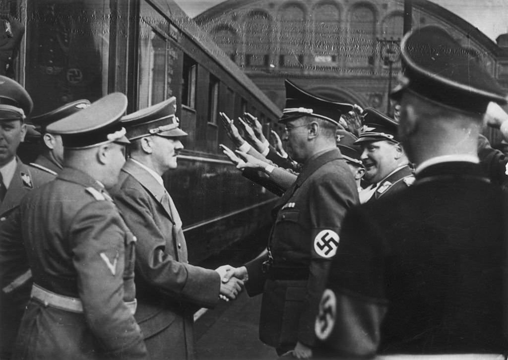 After signing the Munich Pact, German chancellor, Adolf Hitler (1889 - 1945) returns to Berlin in triumph and is greeted by Konrad Henlein (right), leader of the Sudeten German Party.