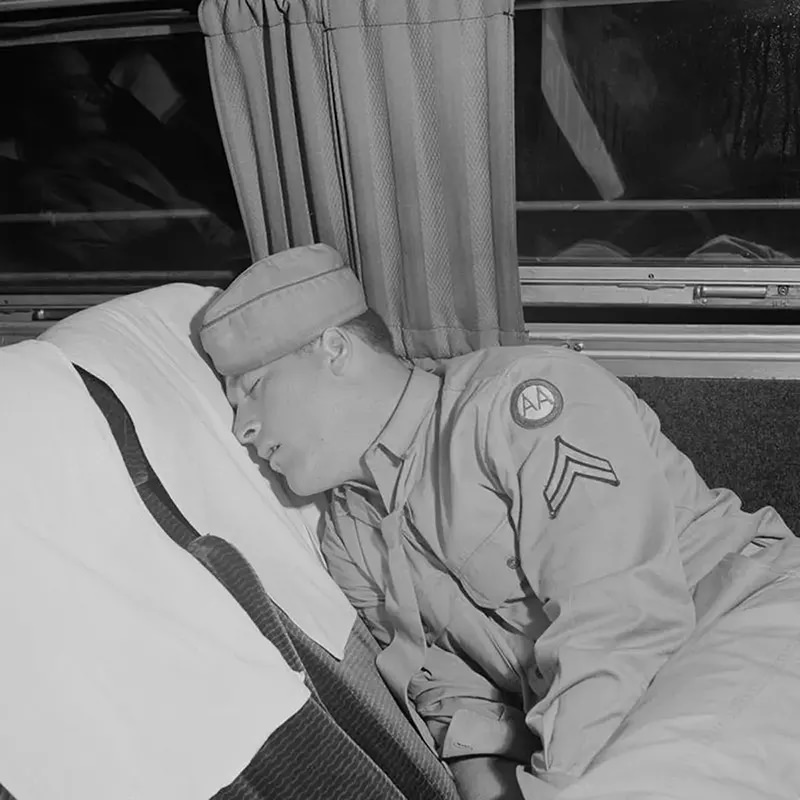 A soldier sleeps on a bus from Cincinnati to Louisville.