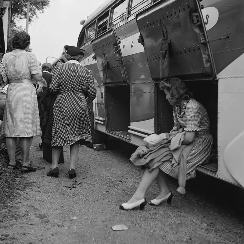 A passenger watches luggage being unloaded from a bus that broke down in a small town in Pennsylvania.