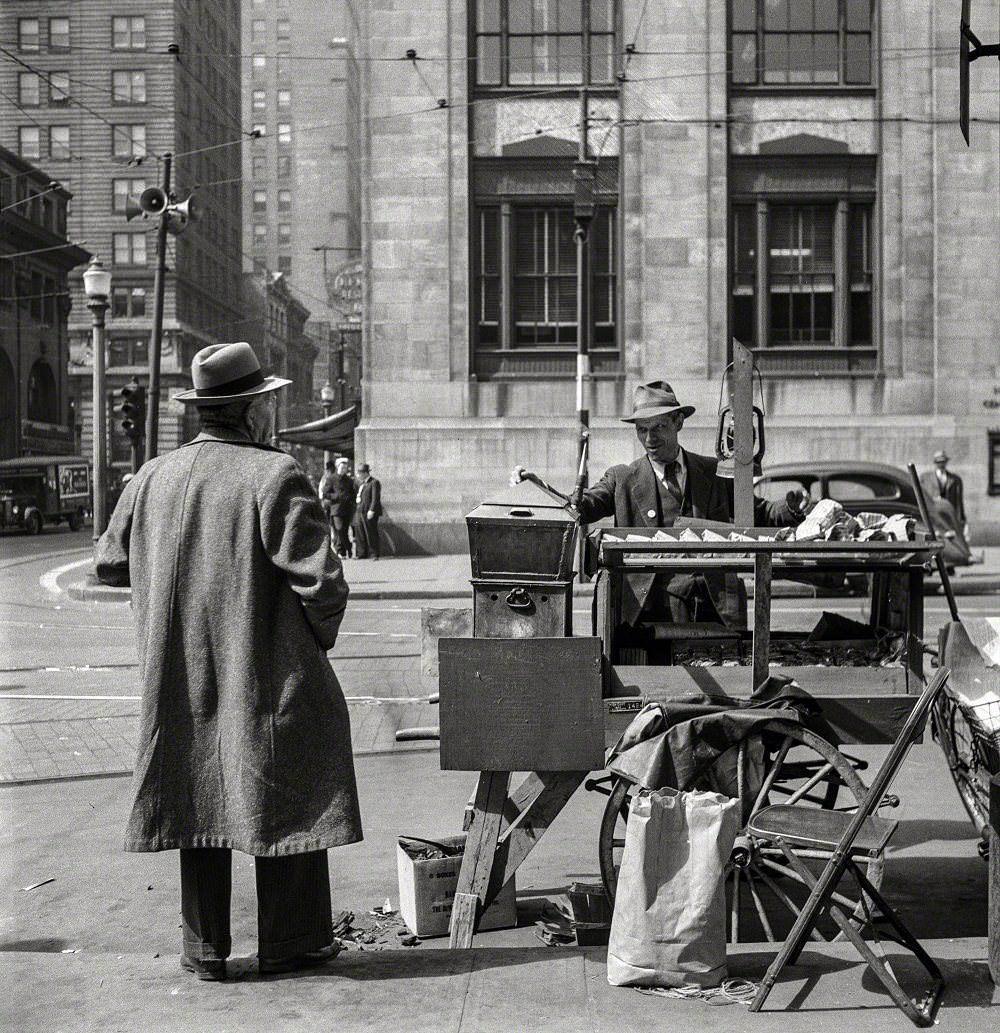 A Peanut seller North East corner of the intersection of E. Baltimore St. & Holliday St., 1943