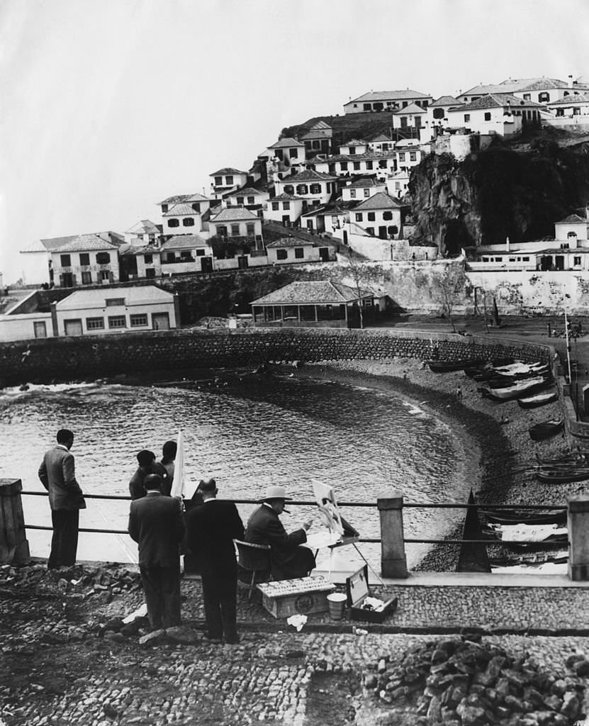 British statesman Winston Churchill (1874 - 1965) paints the fishing village of Camara de Lobos, during a holiday in Madeira, 9th January 1950.