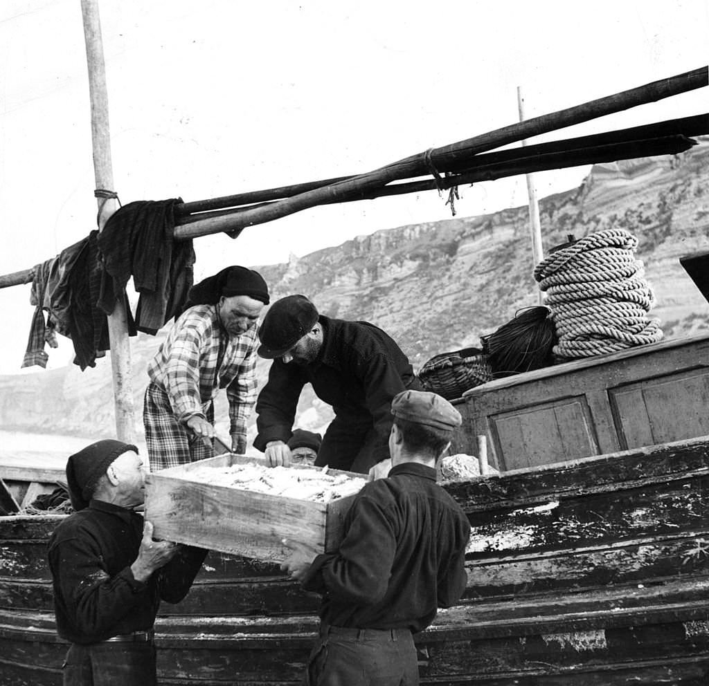 Fishermen in Nazare, Portugal, with their catch.