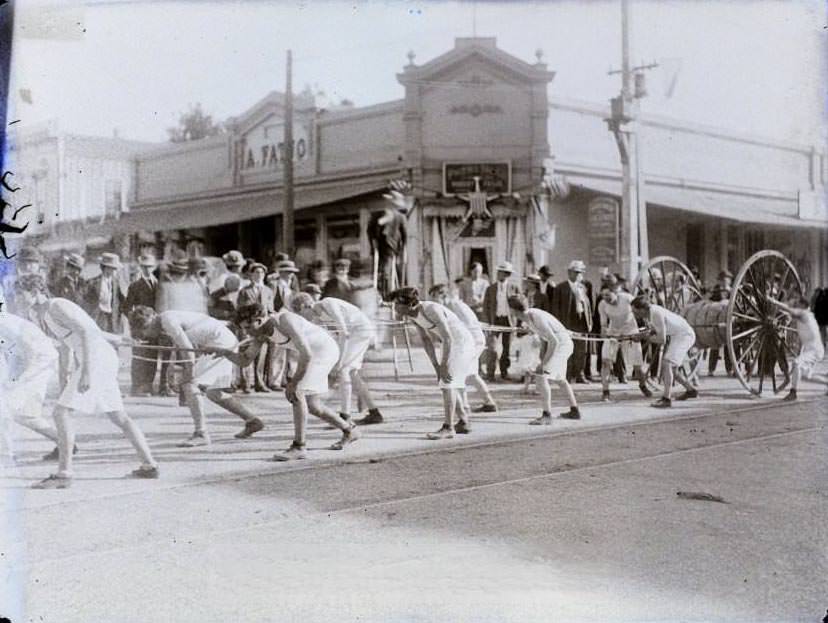 Possibly a parade, young men pulling hose, Lodge building, 1860