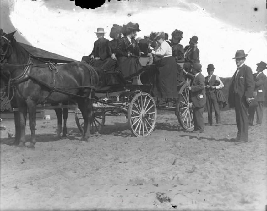 Loading wagon with people, 1860s