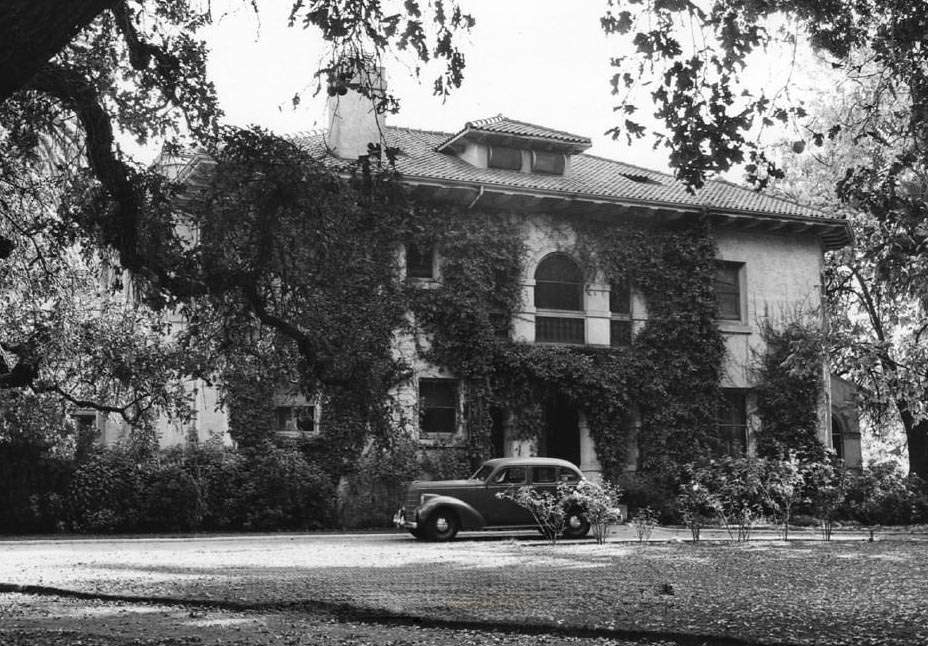 Hayes Mansion front entrance with automobile parked in front, 1940s