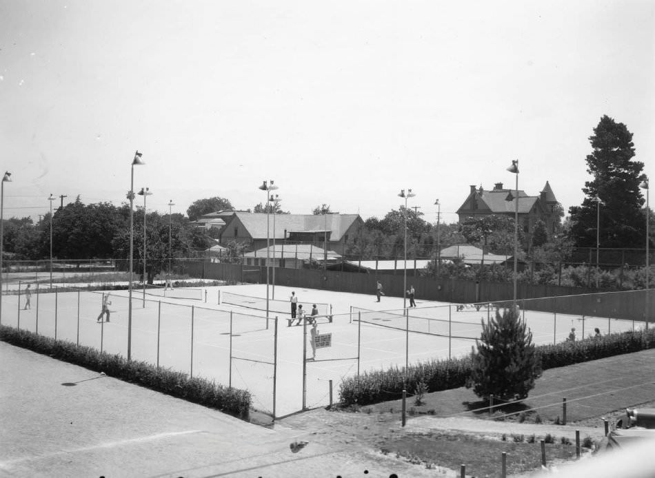 Roosevelt Tennis Courts, San Jose, California. People playing on one of three tennis courts, 1935