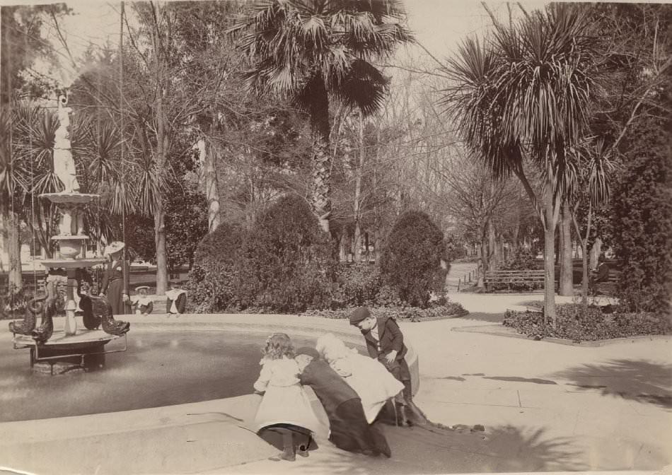 Children looking into a fountain, Saint James Park, San Jose, 1904