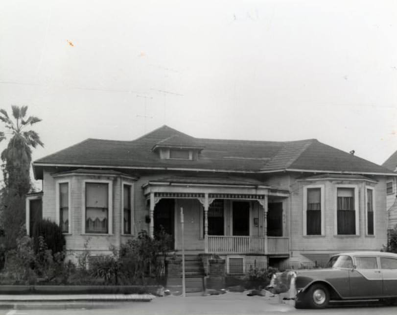 Single-story home with car parked in front, 1940