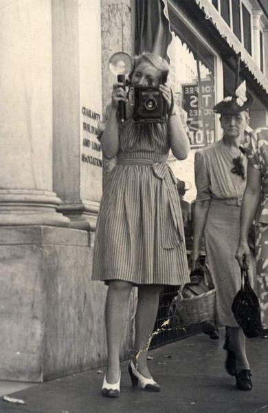 Shirlie Montgomery with camera, 1950