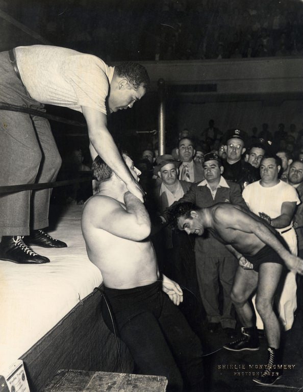 World Heavyweight Champion boxer Joe Louis keeps the peace, 1953