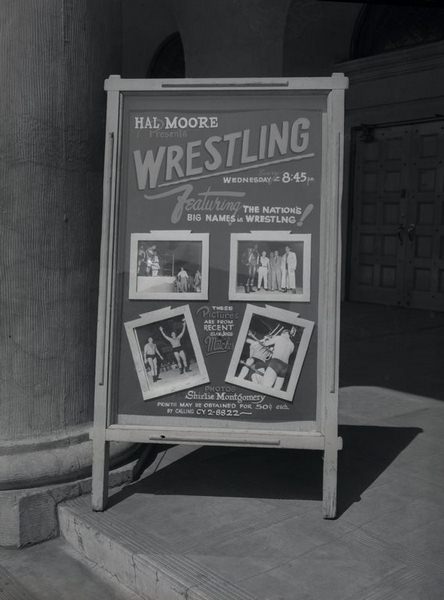 Sandwich board displaying Montgomery's photographs, 1955