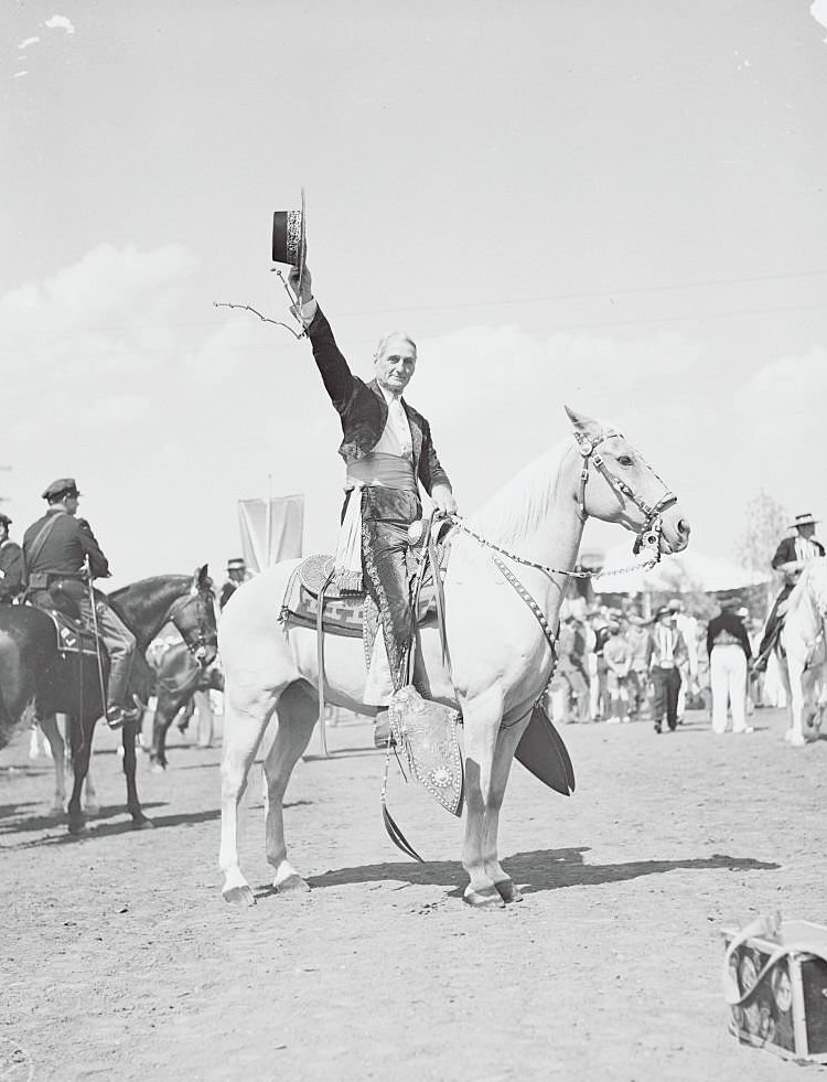 Senator William G. McAdoo on a Horse and Holding up His Hat, 1930s