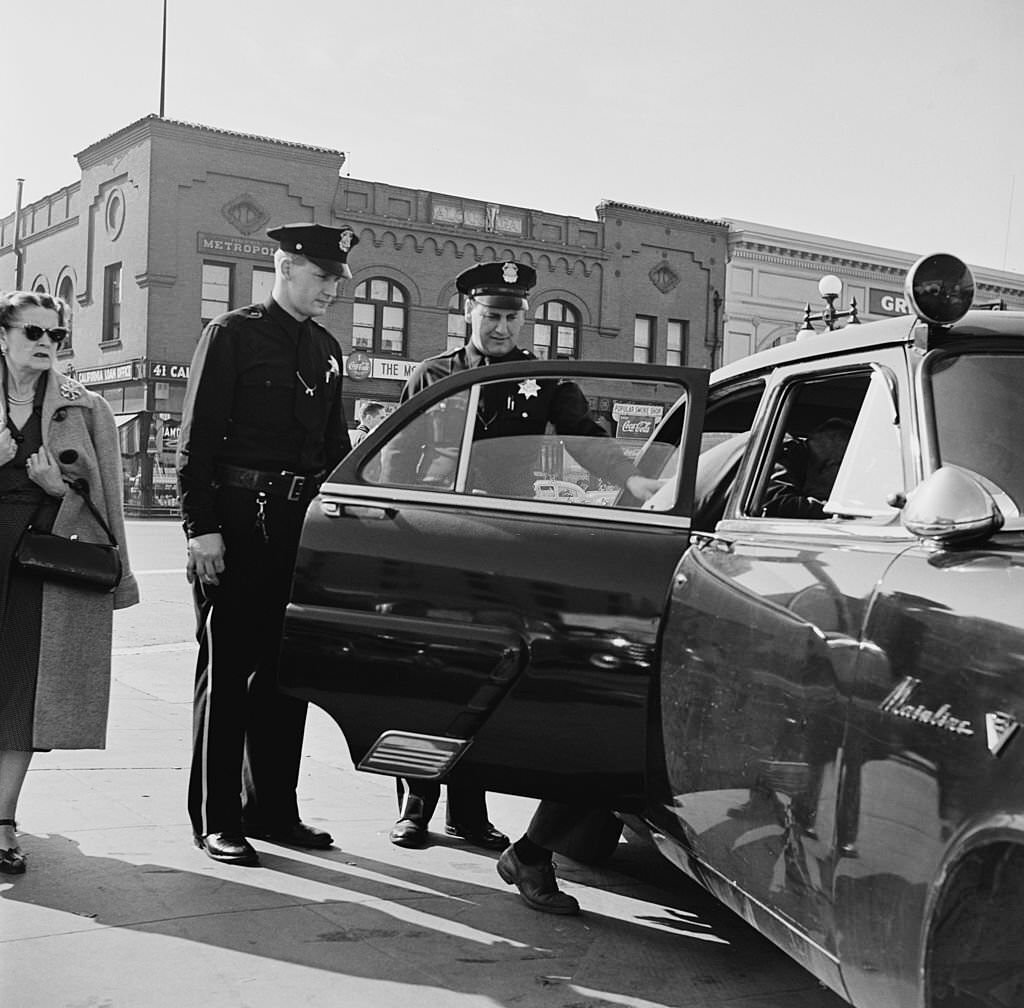 Lyle Hunt, a police officer in San Jose, California, makes an arrest, 1954.