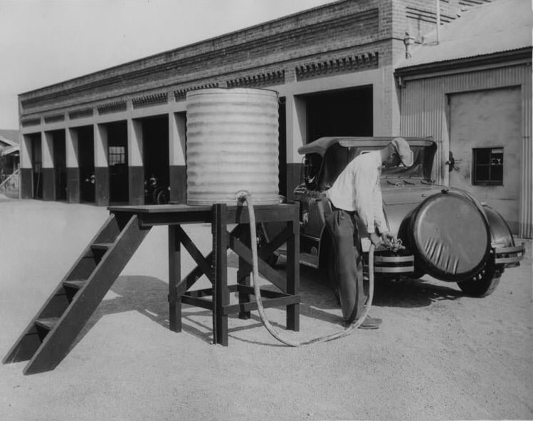 Pumping gas from a barrel, San Jose, 1930