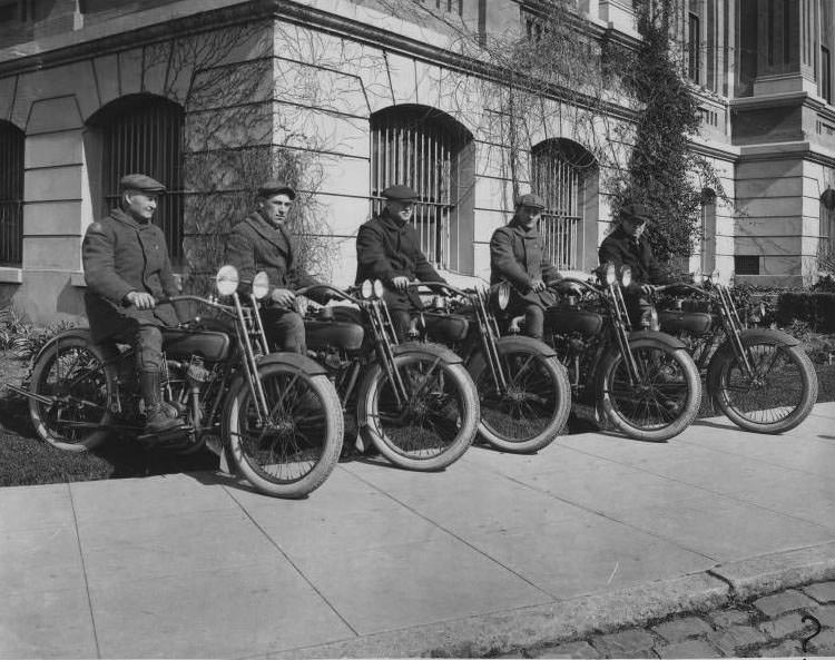 5 men sitting on Harley-Davidson motorcycles in front of courthouse, San Jose, 1940