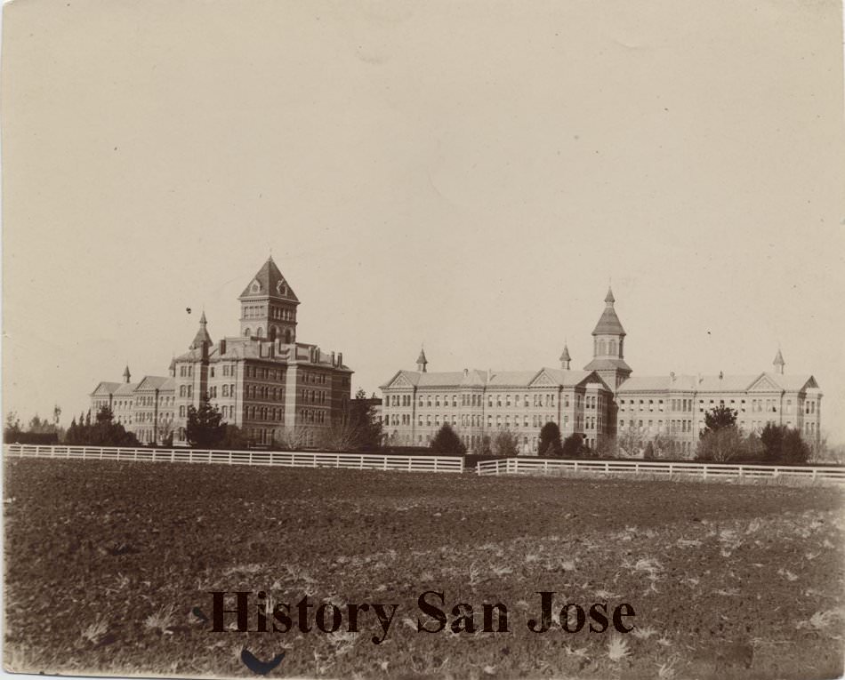 Agnews State Hospital, long shot across field from rear-side, San Jose, 1890