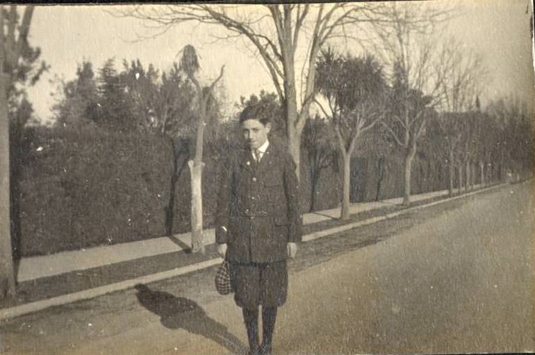 Hansen boys standing on road outside of Winchester estate, 1910s