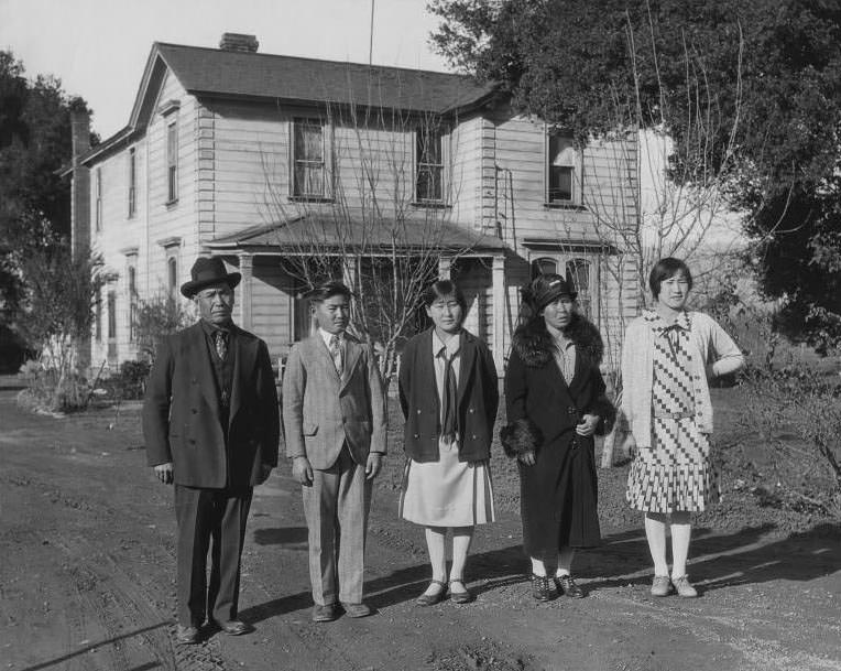 Japanese family in front of their house, 1930