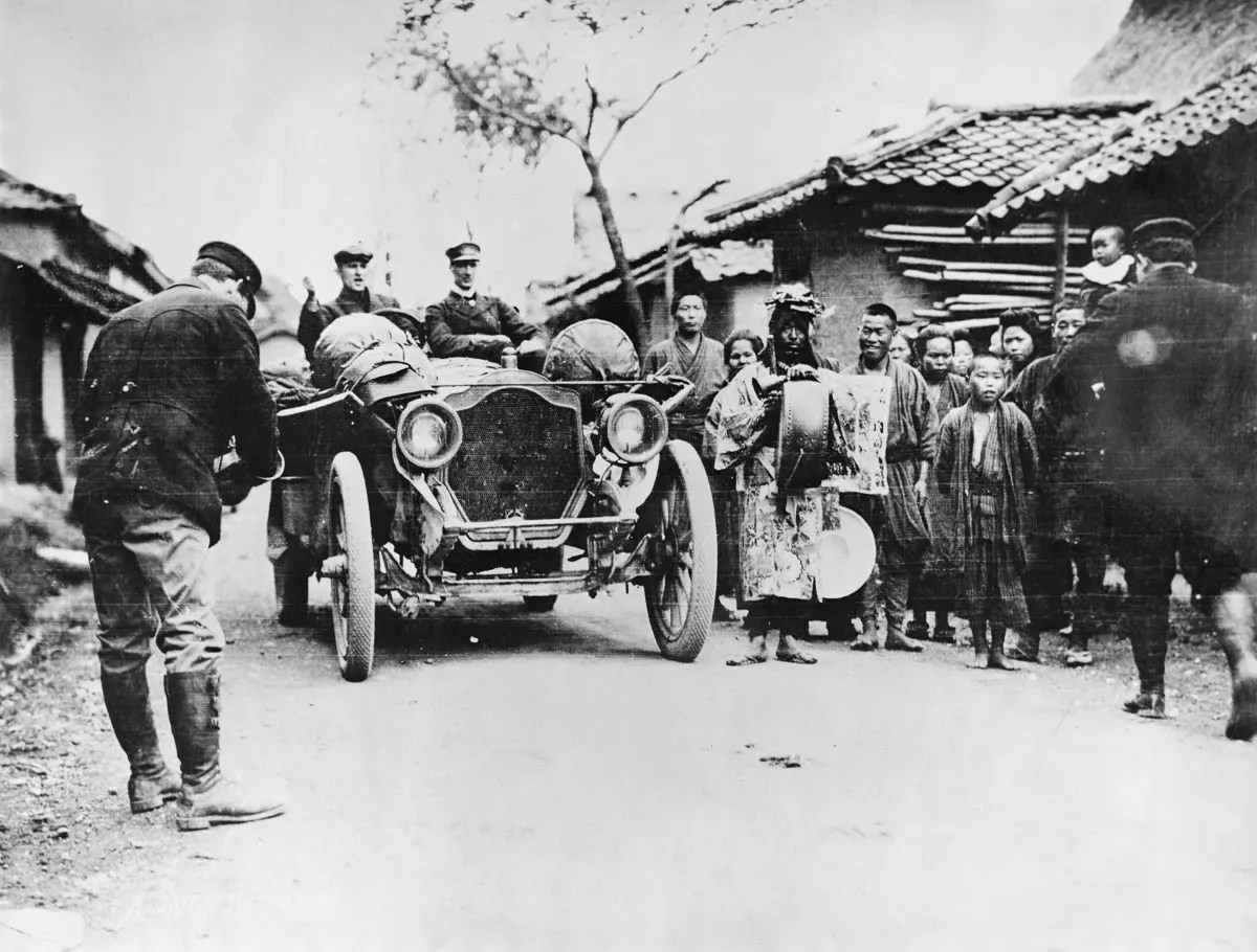 The American Thomas Flyer car drives through Manchuria.