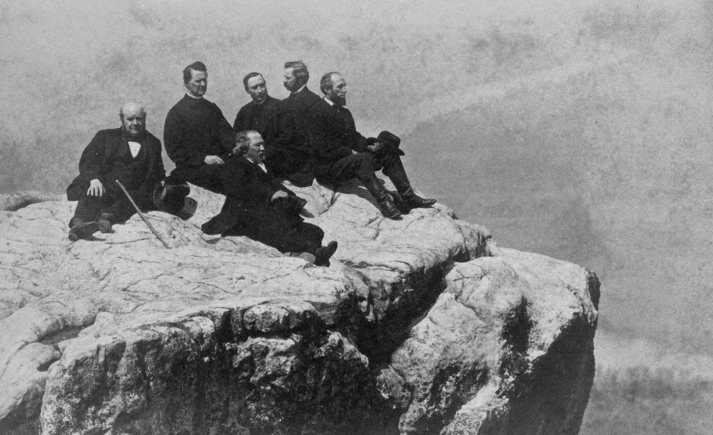 People posing on Tennessee's Umbrella Rock in Lookout Mountain, 1860-1940