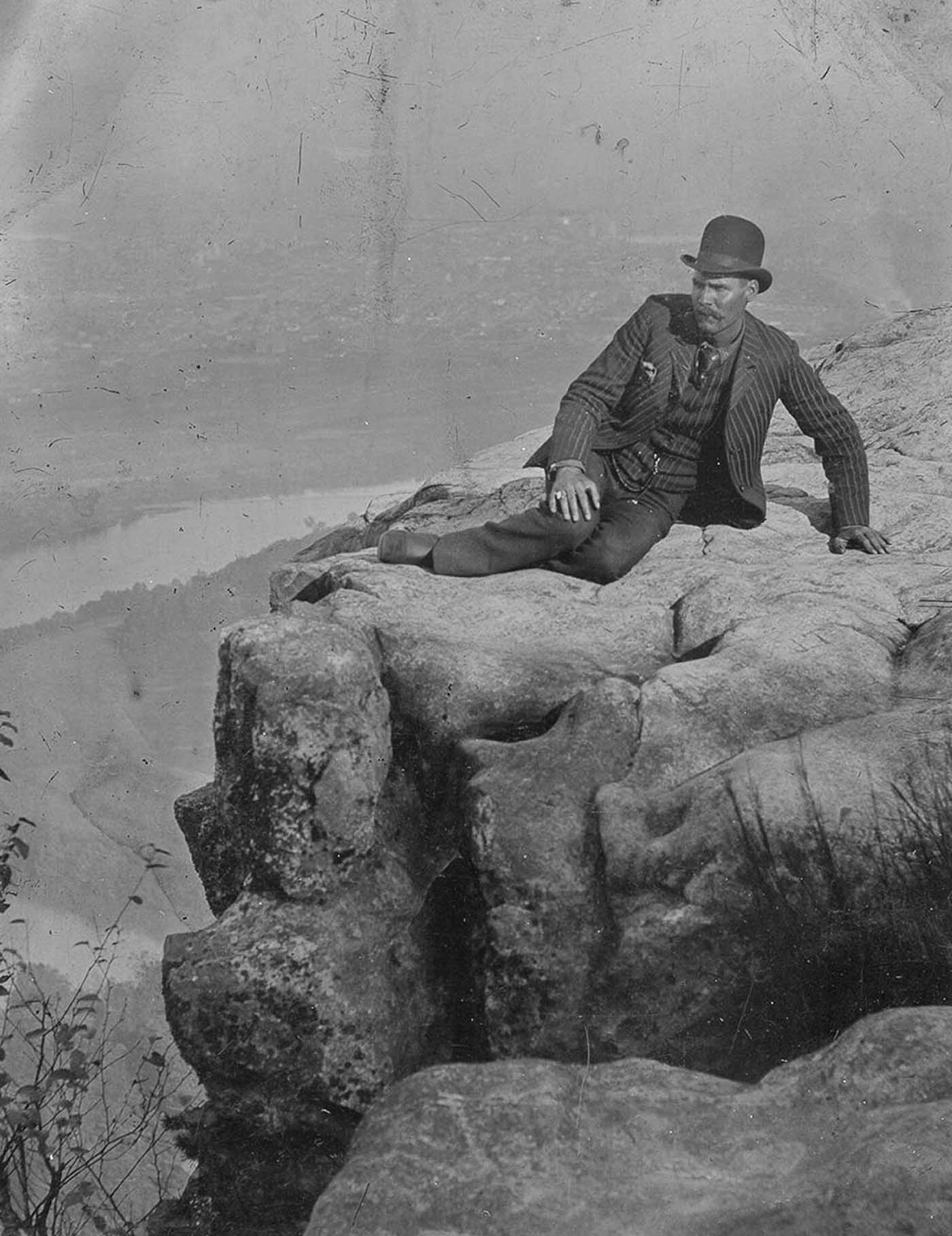 People posing on Tennessee's Umbrella Rock in Lookout Mountain, 1860-1940