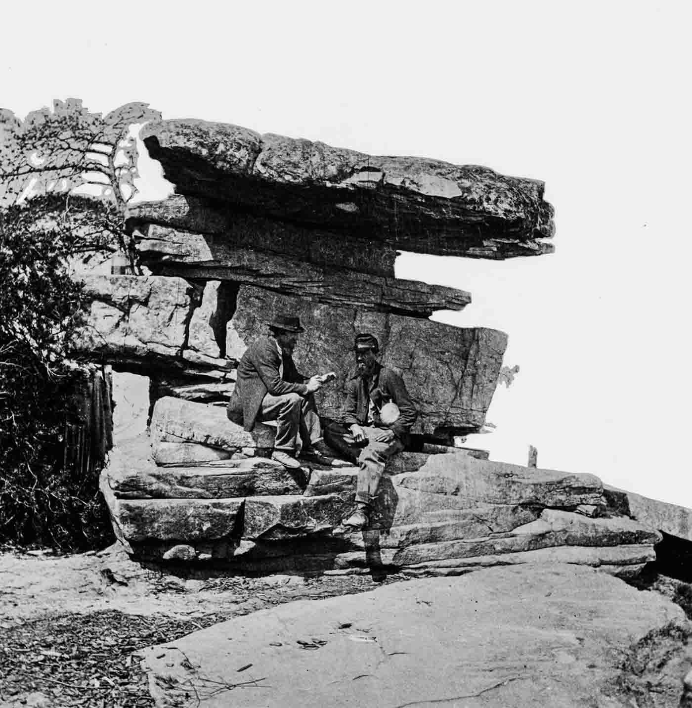 People posing on Tennessee's Umbrella Rock in Lookout Mountain, 1860-1940