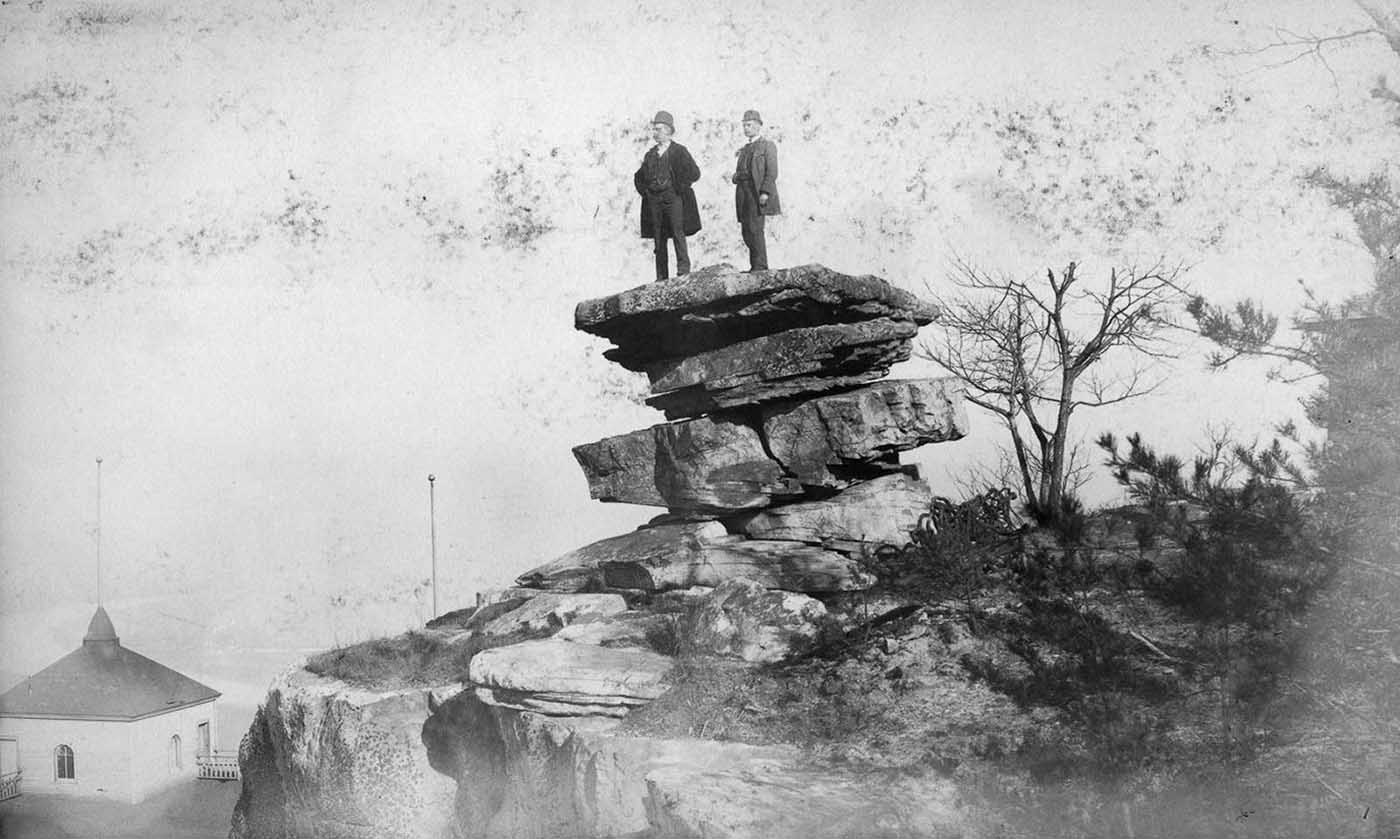 People posing on Tennessee's Umbrella Rock in Lookout Mountain, 1860-1940