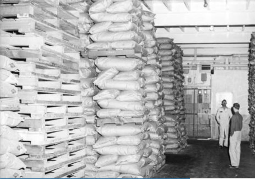 Bags of beer ingredients sit on crates at the Lucky Lager Brewery in Vancouver, 1953