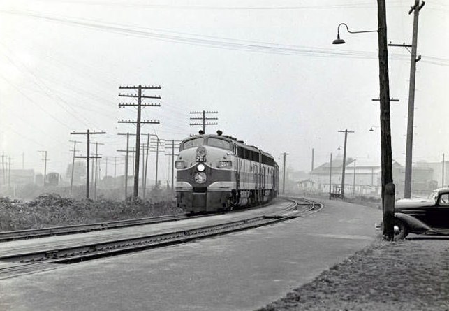 A Great Northern engine 261 heading southbound on railroad tracks in Vancouver, 1952.