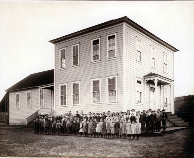 Students gather outside for a photograph at Harney school in Vancouver, 1932