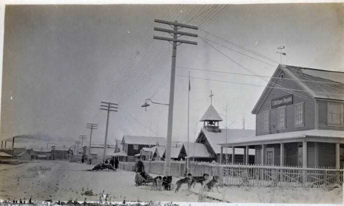 A dog team is photographed outside of St. Matthew's Hospital in Fairbanks, 1940s