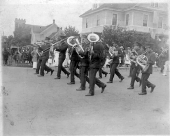 The New Era Chinese Band marches in a 4th of July parade in Vancouver, 1914