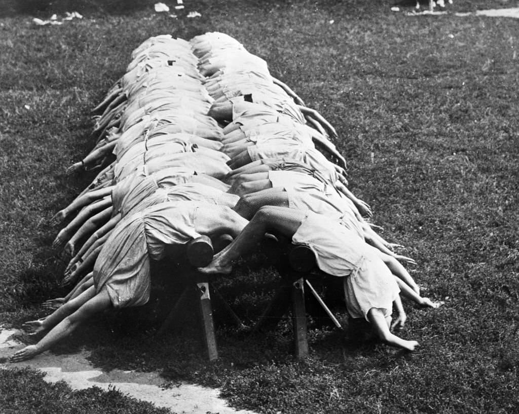 Demonstration of one of the difficult training practices indulged in by French women school teachers, at a Government Physical Training Institute just outside Paris.