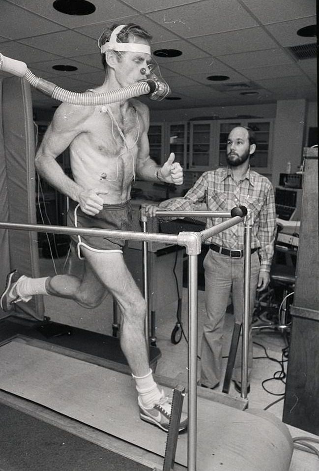 Man Runningon Treadmill, as he runs on a treadmill while his capacity to use oxygen is being measured.