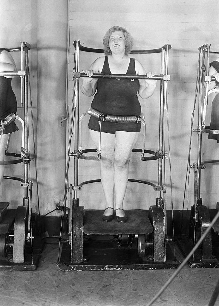 Woman Standing on Exercise Machine.