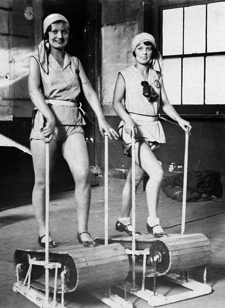Two members of the 'Foster-Girls' on treadmills, 1930