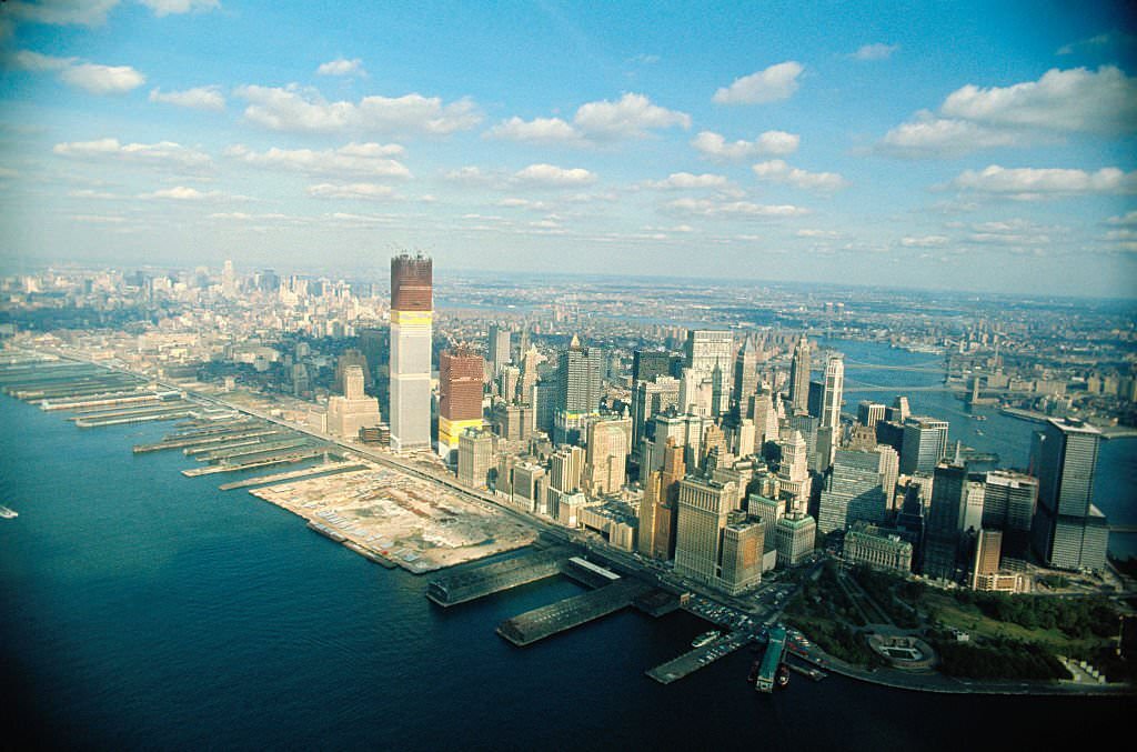 Aerial views of Manhattan featuring World Trade Center under construction.