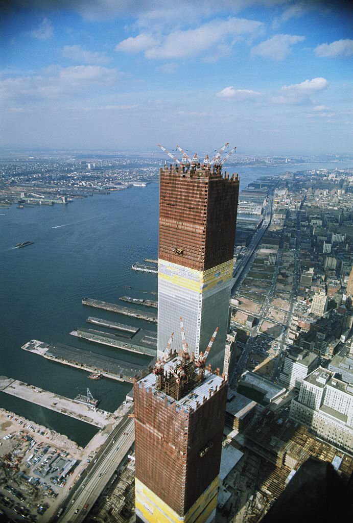 Airview of one of the two towers of the World Trade Center, as workers put into place steel sections which brought the building to a height of 1,254 feet